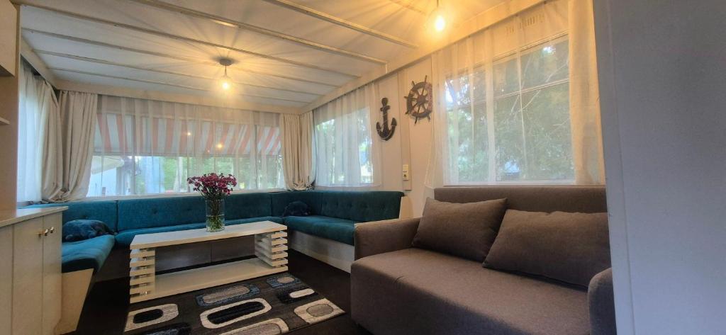 a living room with a couch and a table at Lorex in Pobierowo