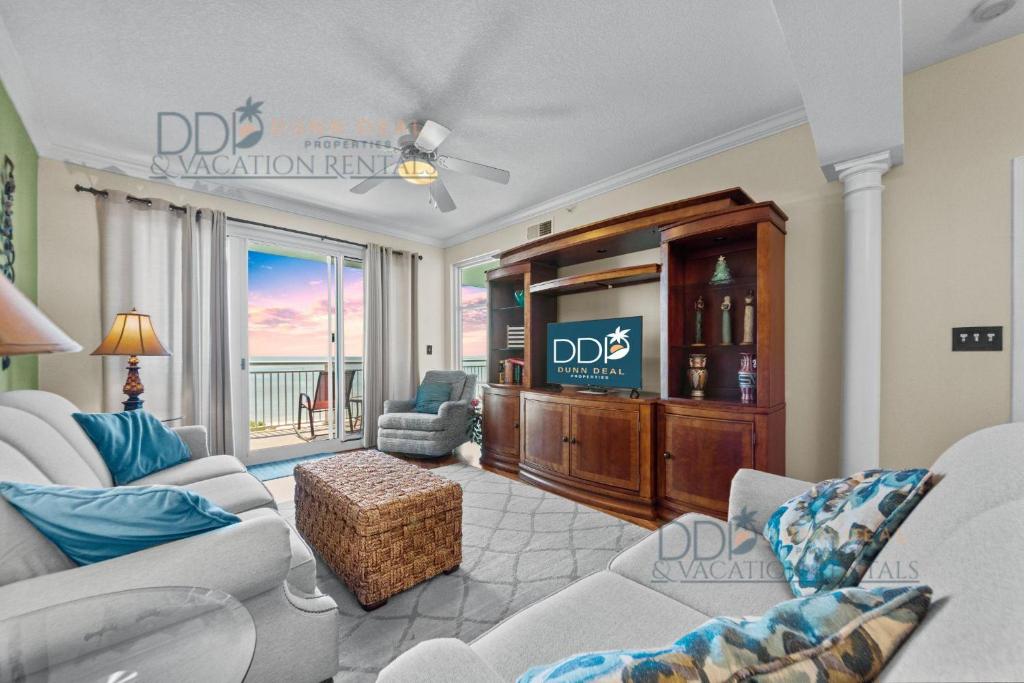 a living room with a couch and a tv at Legacy Tower II 403 in Gulfport