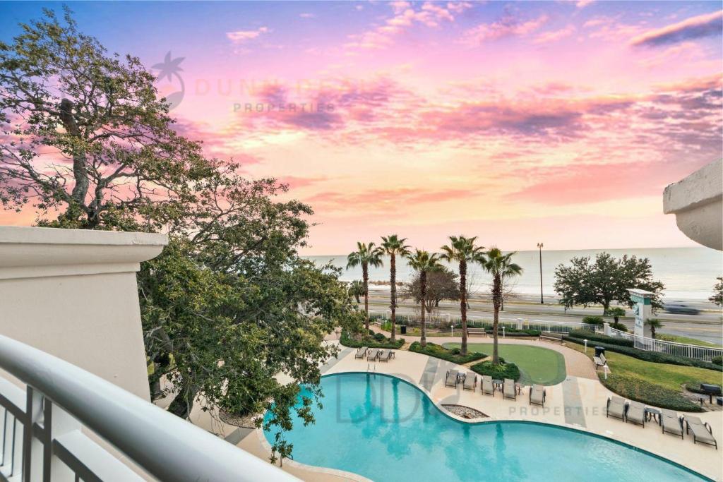 a view of the pool from the balcony of a resort at Legacy Tower I 304 in Gulfport