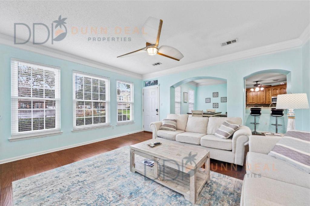 a living room with a couch and a table at Legacy Villa 1501 in Gulfport