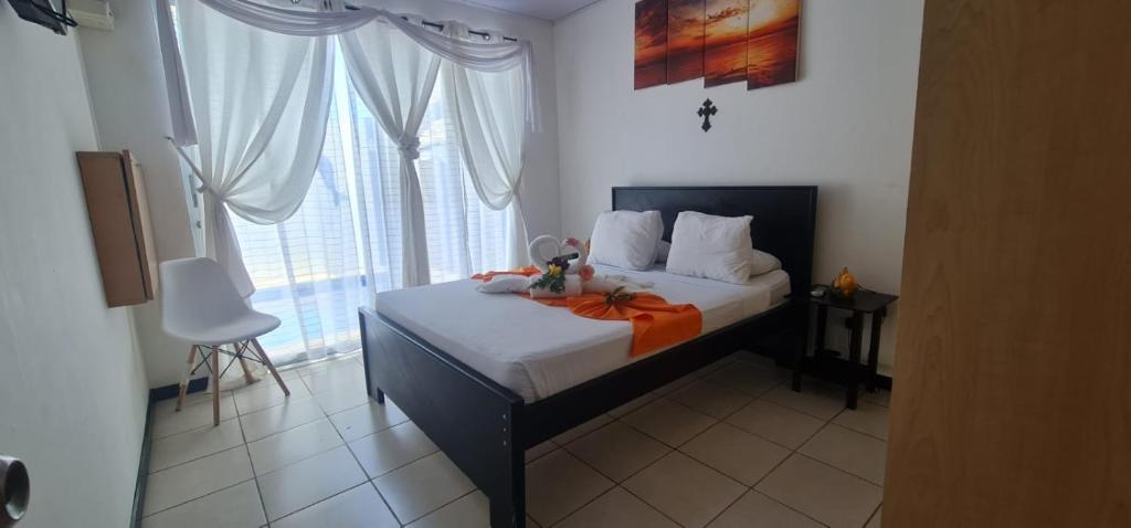 Ένα ή περισσότερα κρεβάτια σε δωμάτιο στο Casa vacacional Playa Herradura