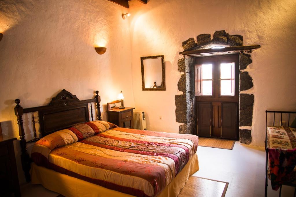 Postel nebo postele na pokoji v ubytování Casa Rural Finca Isabel