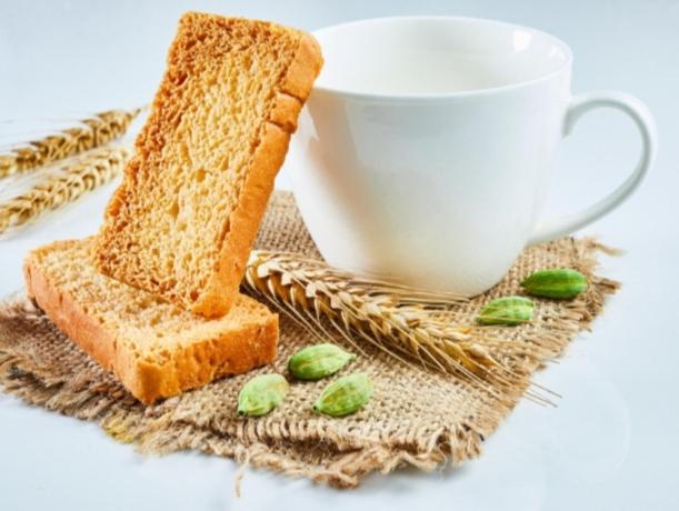 a slice of bread next to a cup of coffee at flowers room au coeur de saint Ouen parking gratuit in Saint-Ouen