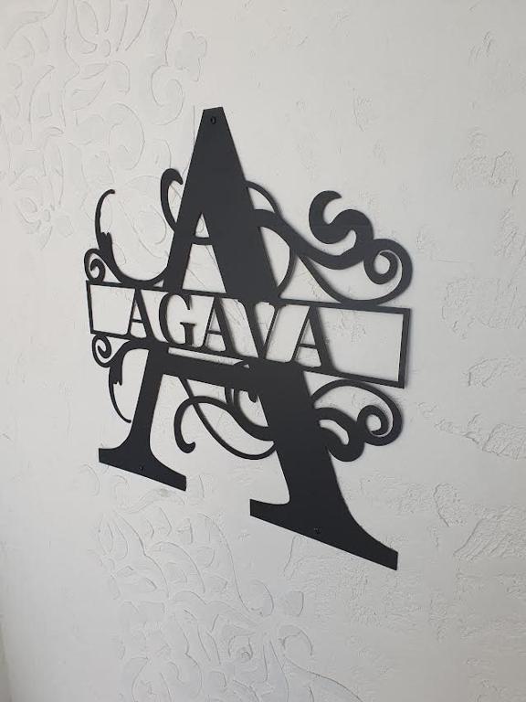 a sign with the letter a on a wall at Ferienwohnung Agava in Michelstadt