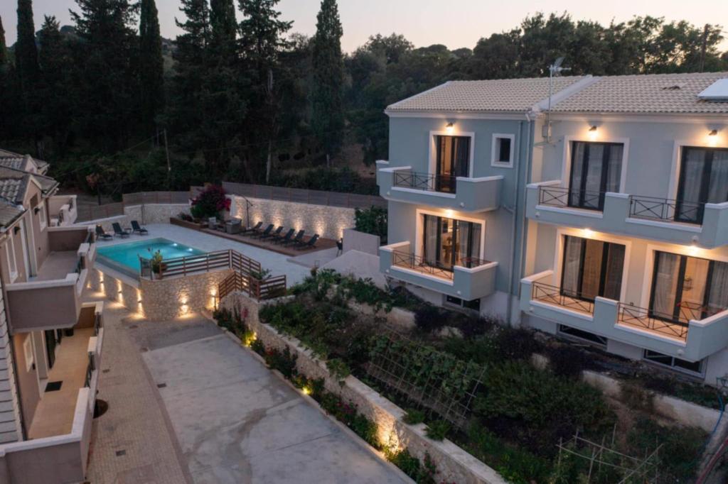 an aerial view of a house with a swimming pool at Marios Suite Corfu in Corfu