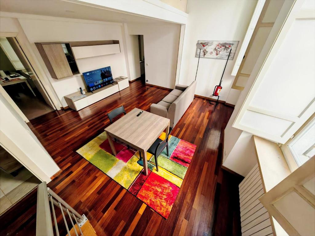 an overhead view of a living room with a wooden table at MS Piazza del Papa Sea Port in Ancona