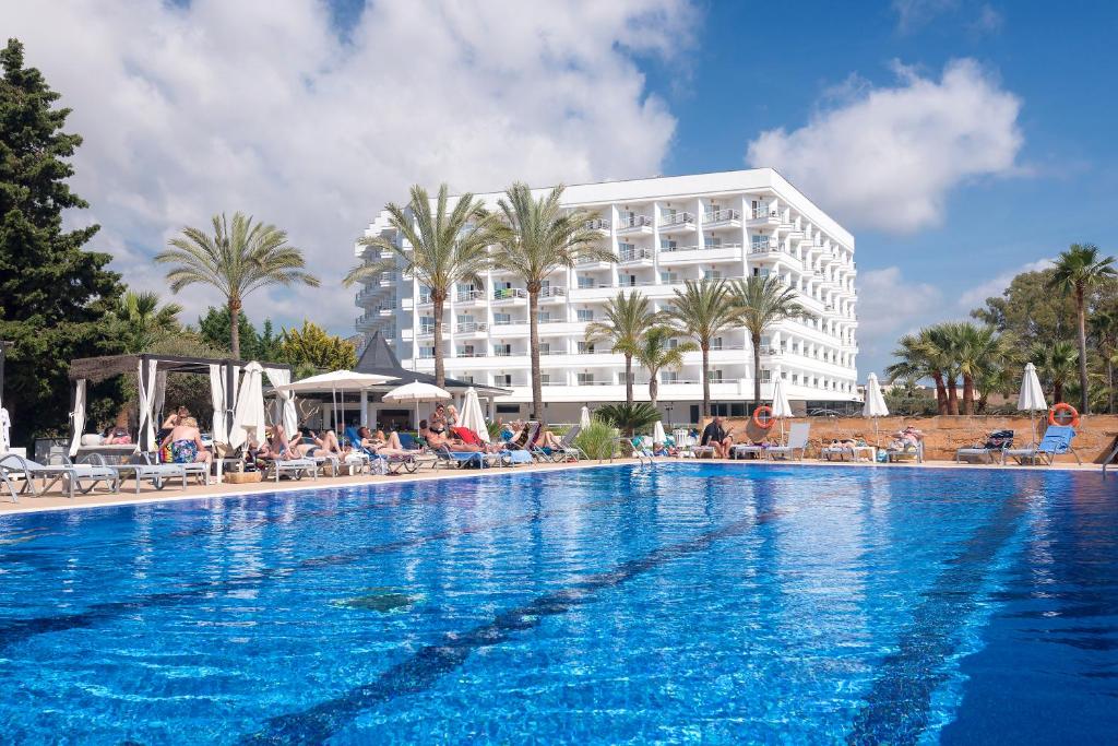 a large swimming pool in front of a hotel at Cala Millor Garden Hotel - Adults Only in Cala Millor