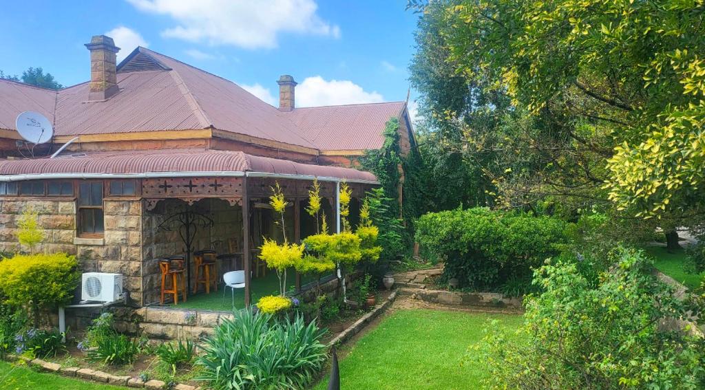 a house with a garden in front of it at The Journey GuestHouse in Ladybrand