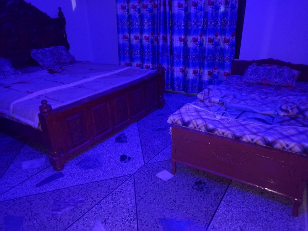 Postel nebo postele na pokoji v ubytování Sardar House