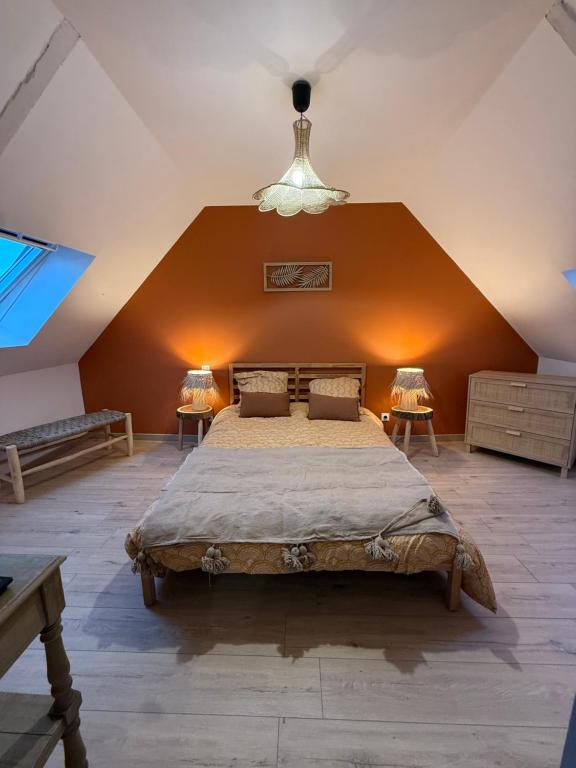 a bedroom with a large bed in an attic at Ty Kermaudez in Paimpol