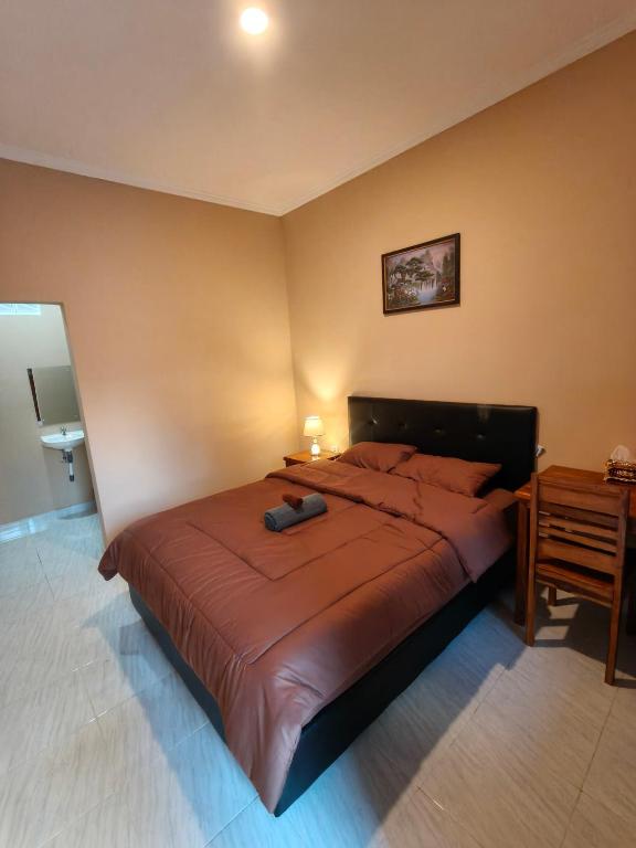 Postel nebo postele na pokoji v ubytování Pondok lasuli 2