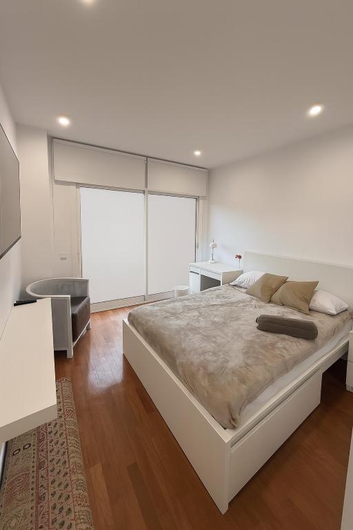 Ένα ή περισσότερα κρεβάτια σε δωμάτιο στο Camp Nou Rooms