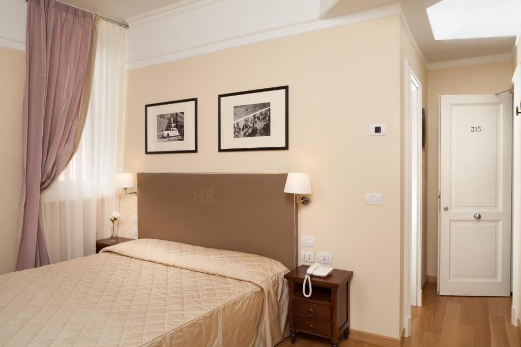 Postel nebo postele na pokoji v ubytování Hotel Executive