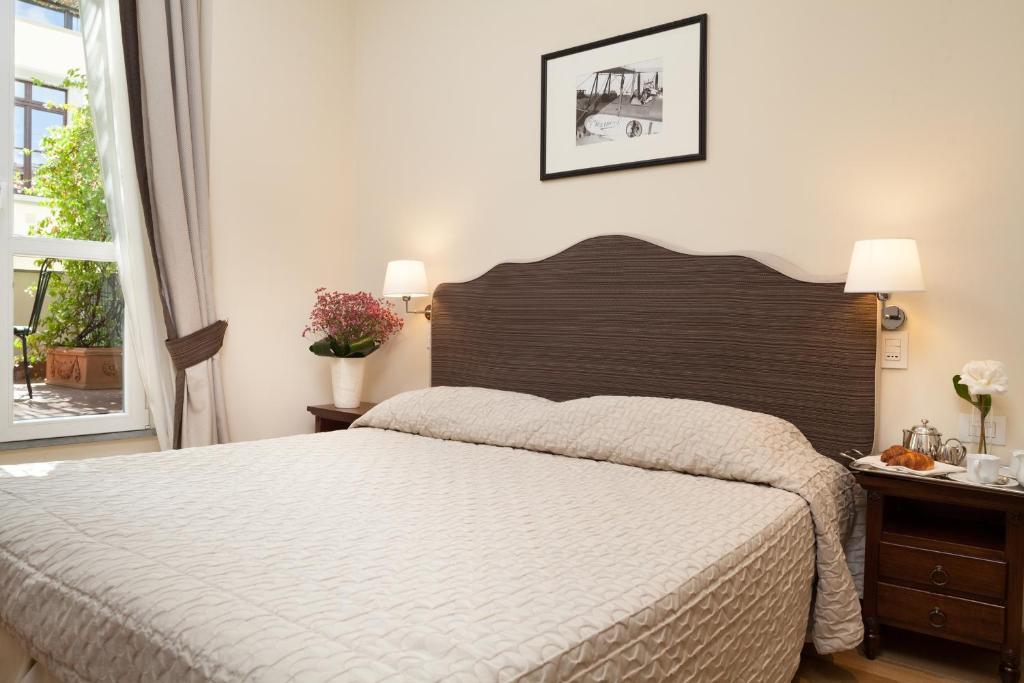 Postel nebo postele na pokoji v ubytování Hotel Executive