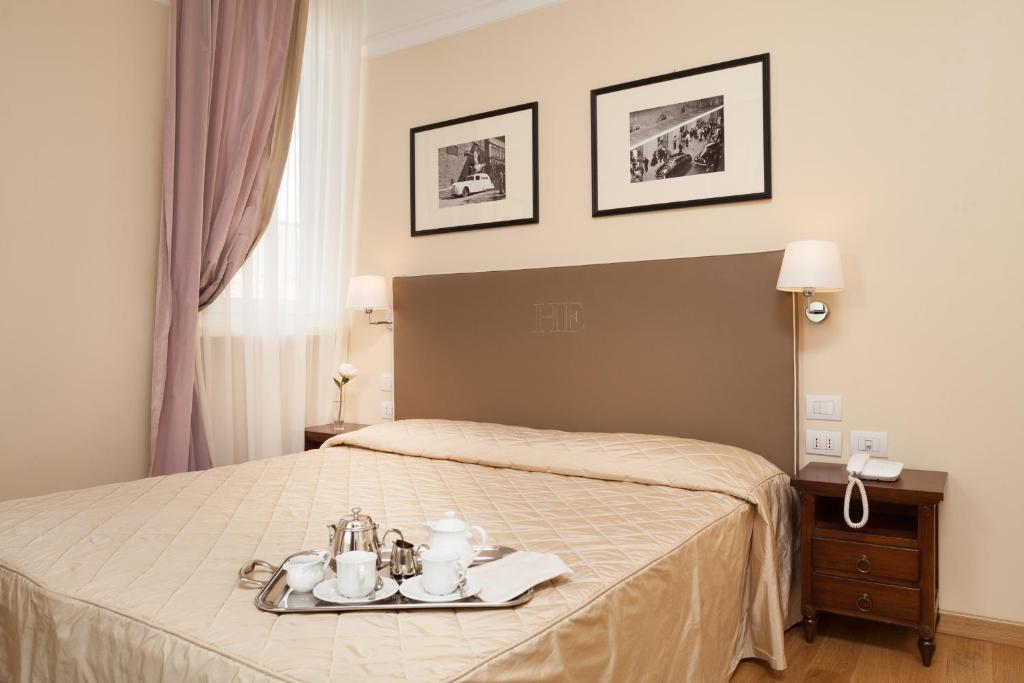 Postel nebo postele na pokoji v ubytování Hotel Executive