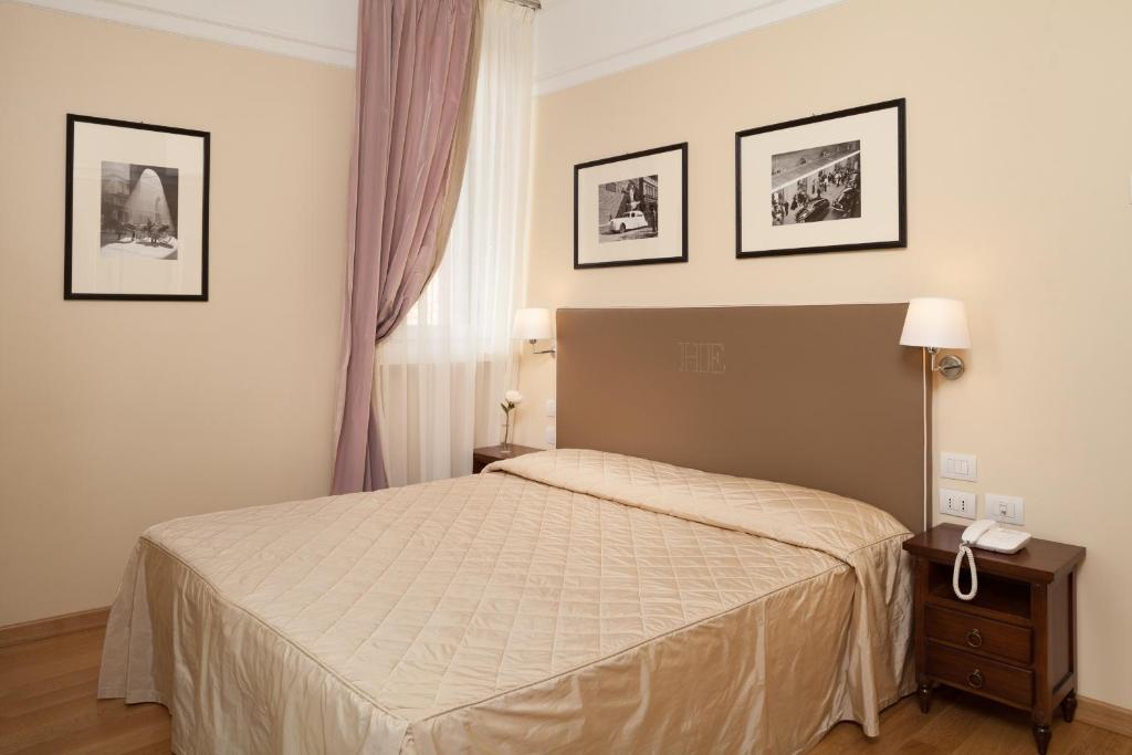 Postel nebo postele na pokoji v ubytování Hotel Executive