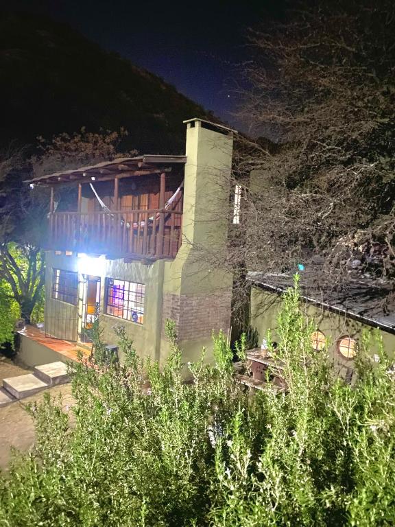 a house with a light on the side of it at night at La casa de Pedro in San Roque