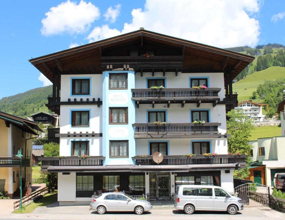 a building with two cars parked in front of it at König - Joker Card included in Summer in Saalbach-Hinterglemm