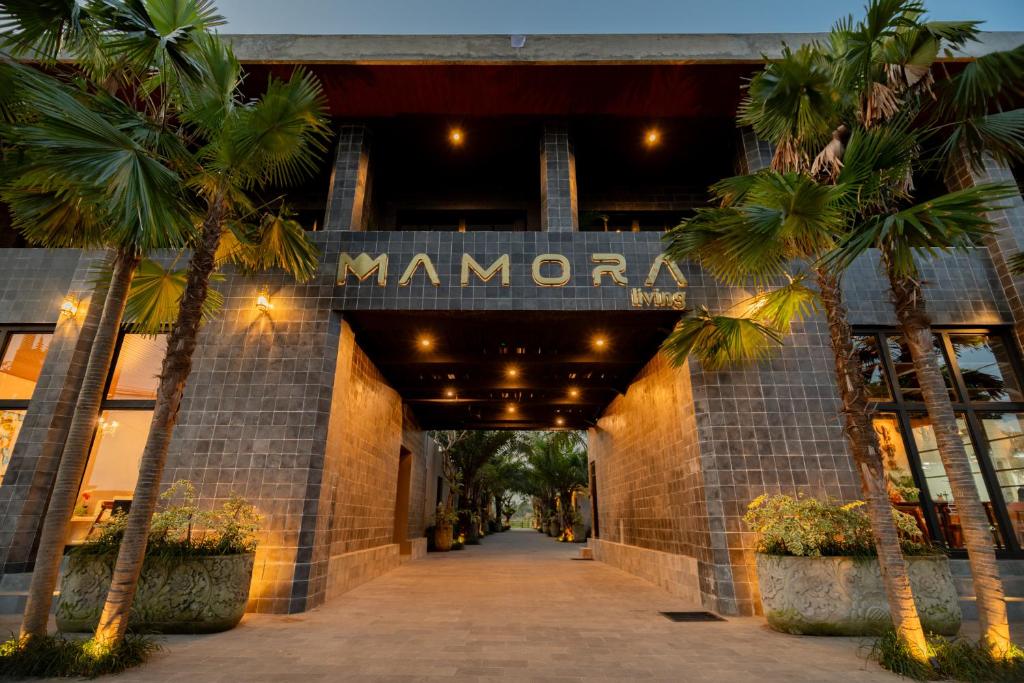 a building with a sign that reads manana at Mamora Living Ubud in Ubud