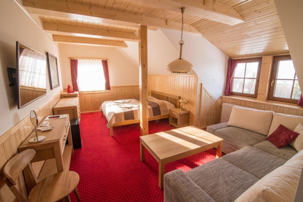 Postel nebo postele na pokoji v ubytování Penzion U Pacošů