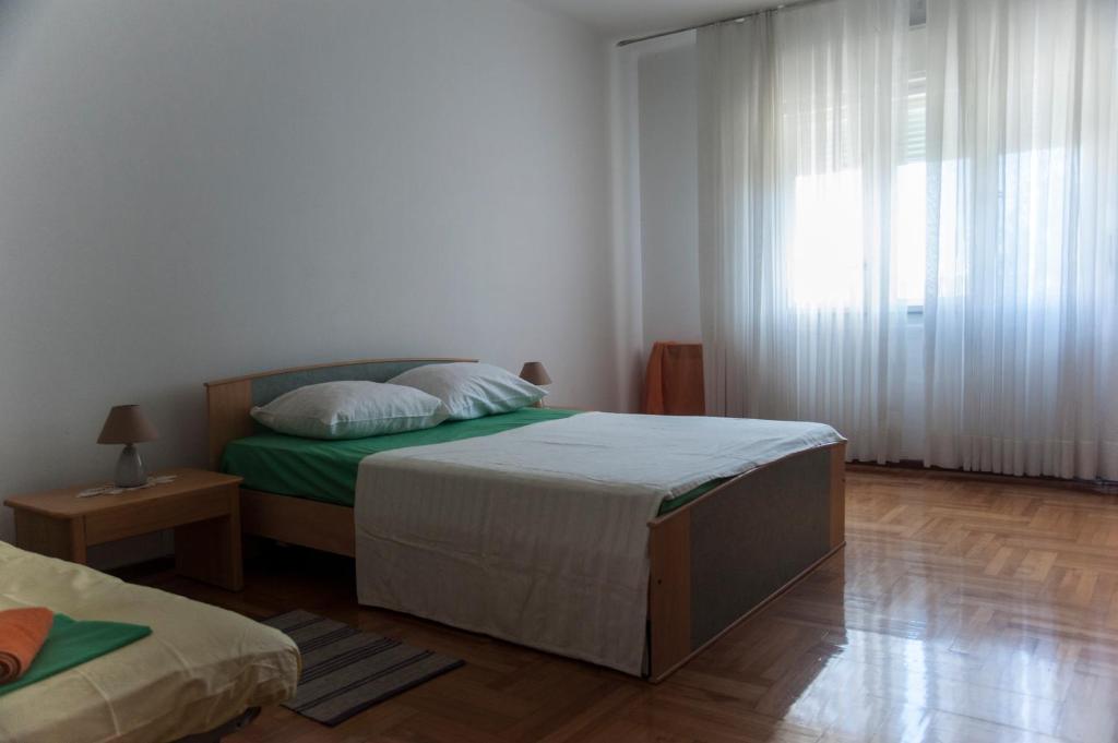Posteľ alebo postele v izbe v ubytovaní Apartment O.K.