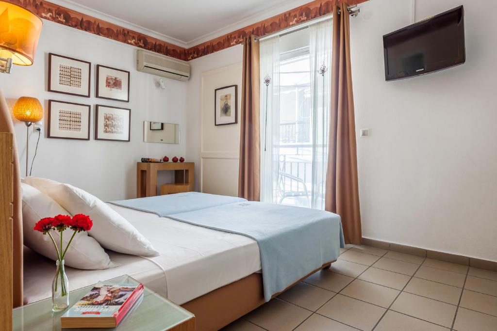 Postel nebo postele na pokoji v ubytování Hotel Akti