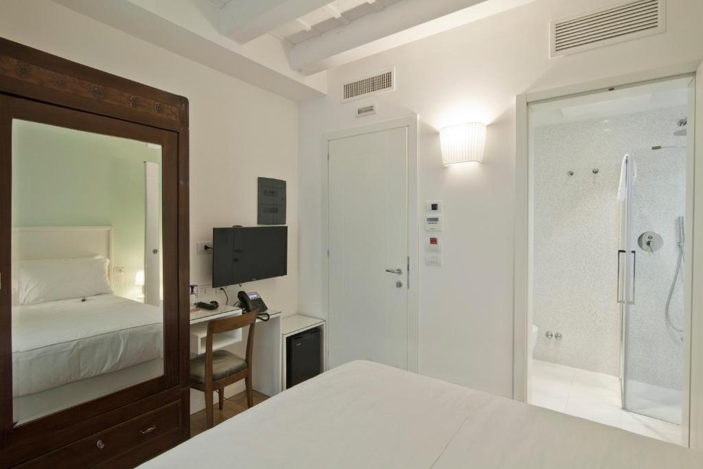Postel nebo postele na pokoji v ubytování Chiara - Lodge