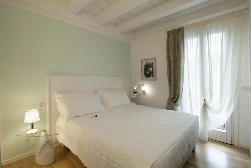 Postel nebo postele na pokoji v ubytování Chiara - Lodge