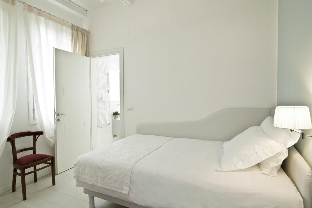 Postel nebo postele na pokoji v ubytování Chiara - Lodge