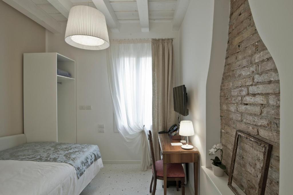 Postel nebo postele na pokoji v ubytování Chiara - Lodge