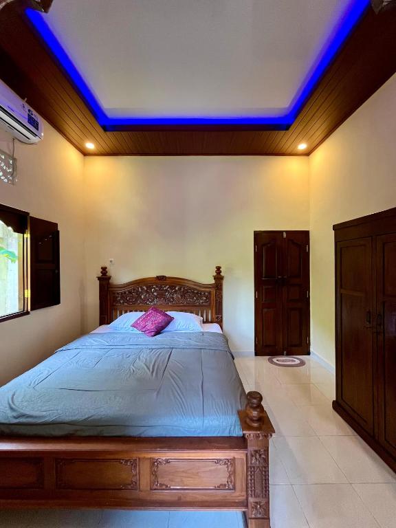 Ένα ή περισσότερα κρεβάτια σε δωμάτιο στο Danen Homestay