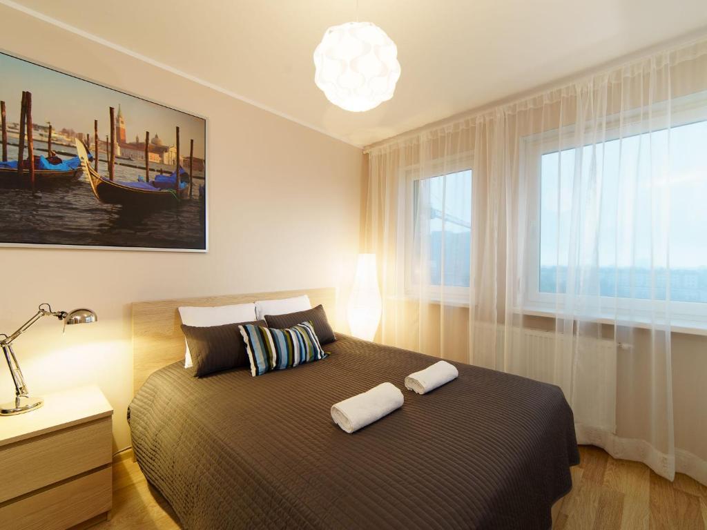 Postel nebo postele na pokoji v ubytování Marcelin Apartments Poznań