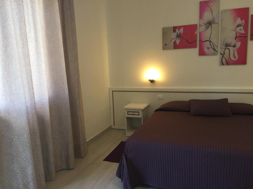 Postel nebo postele na pokoji v ubytování Albergo Ester