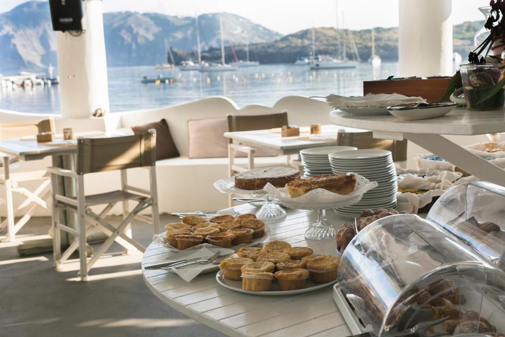 a table with a bunch of pastries and desserts on it at Mari del Sud Resort in Vulcano