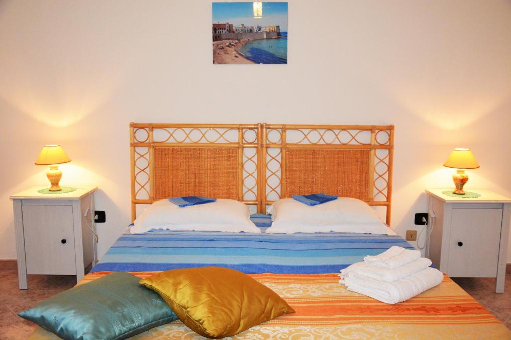 A bed or beds in a room at Salenterra B&B (Salento)