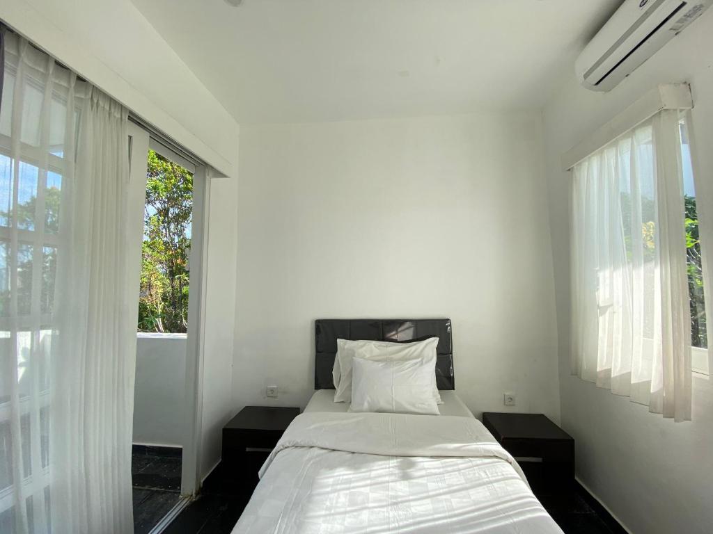 Ένα ή περισσότερα κρεβάτια σε δωμάτιο στο apartement nata umalas