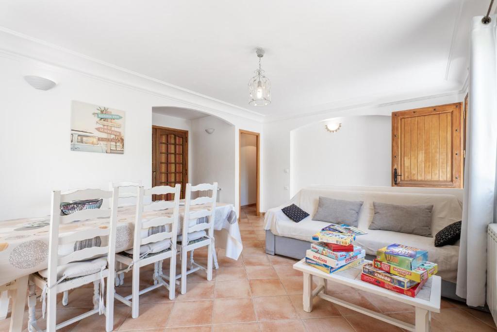 a living room with a couch and a table at La Pascaline - 20min de Grasse in Le Bar-sur-Loup