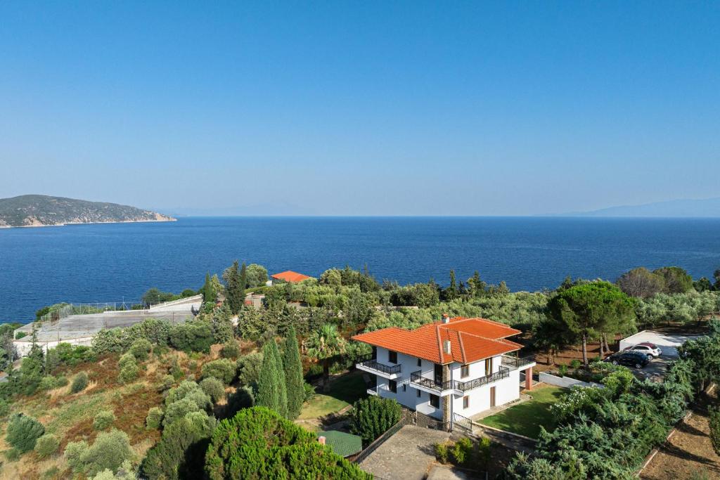 an aerial view of a house with an orange roof at MUSES CHALKIDIKI #Skgbnb in Mesochórion