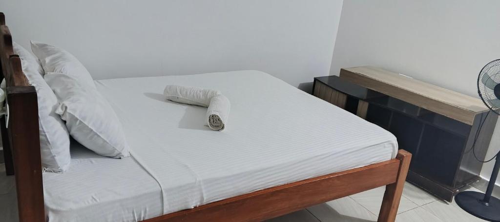 En eller flere senge i et værelse på Palm breeze villa