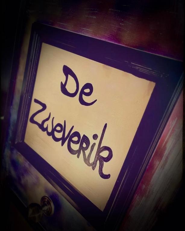 a sign with the words beayaeville written on it at De Zweverik in Dessel