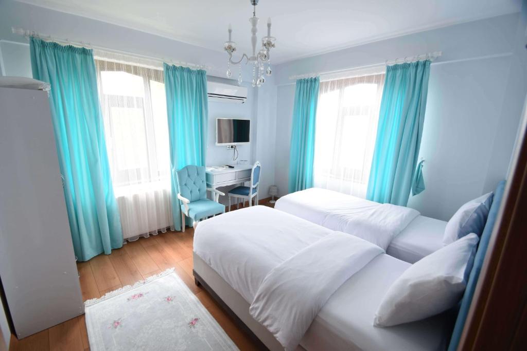 En eller flere senge i et værelse på Hayat Oksijen Resort