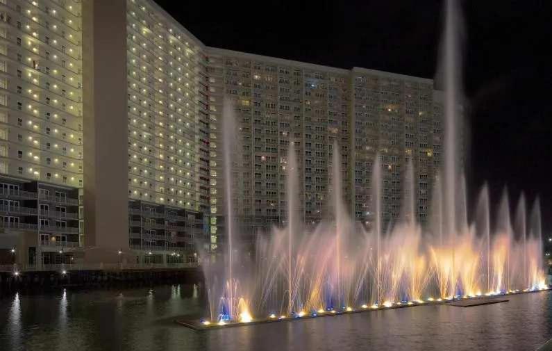 a water fountain in front of a large building at Panama City -3 Bedroom - Laketown Wharf in Panama City Beach