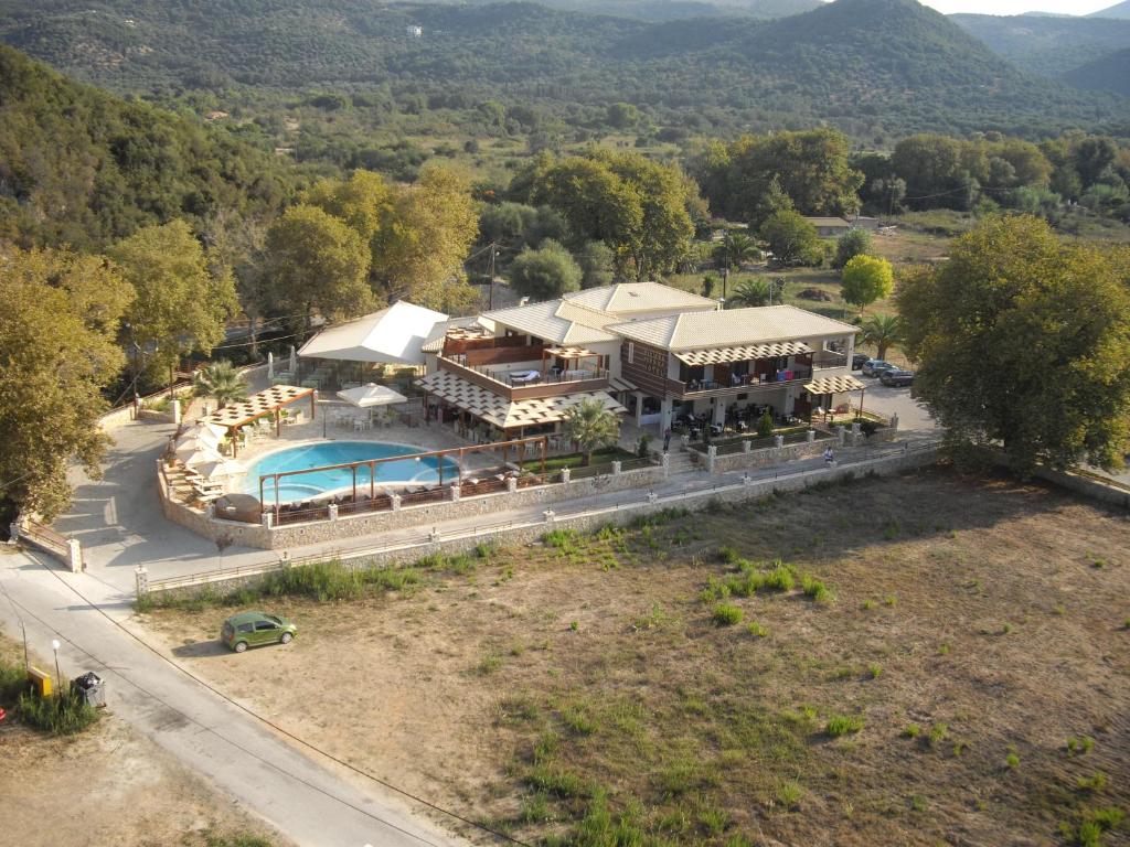 an aerial view of a house with a swimming pool at Riviera Perdika Hotel in Perdika