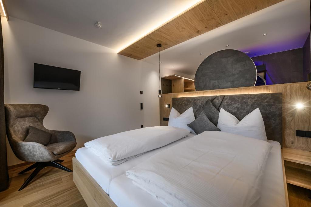 Postel nebo postele na pokoji v ubytování Hotel Hubertushof