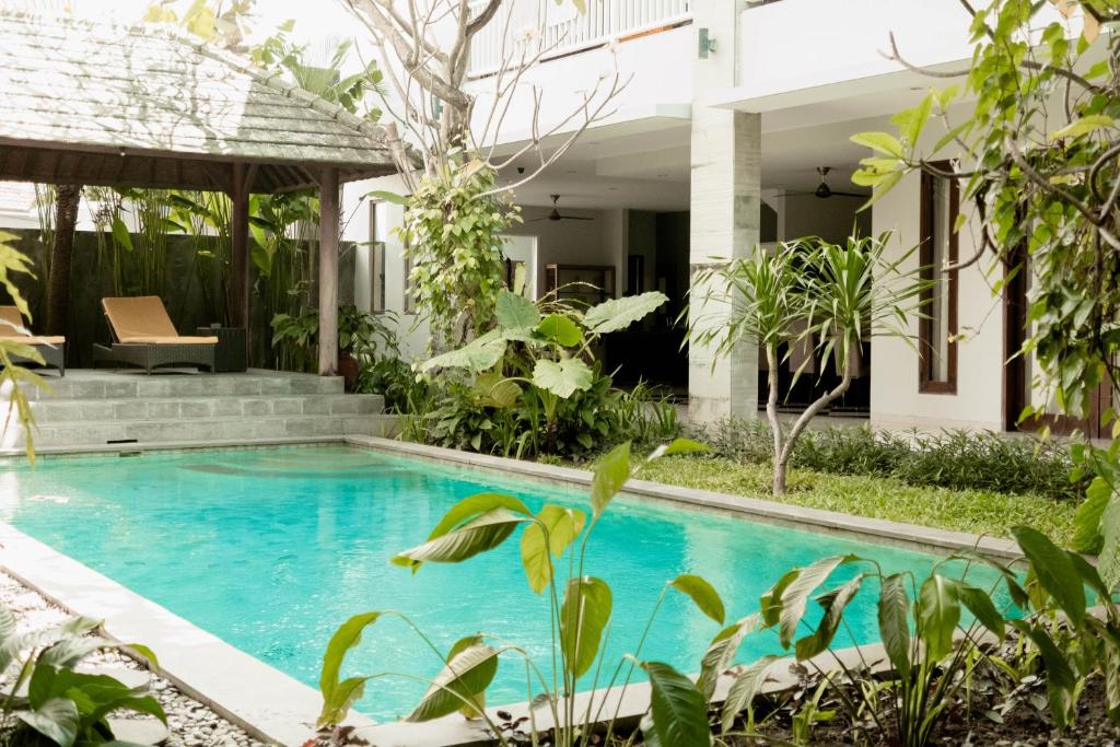a swimming pool in the backyard of a villa at Bali Bliss Residence in Seminyak