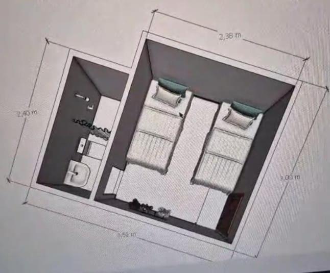 a drawing of a floor plan of a room at COP30 hospedagem in Belém