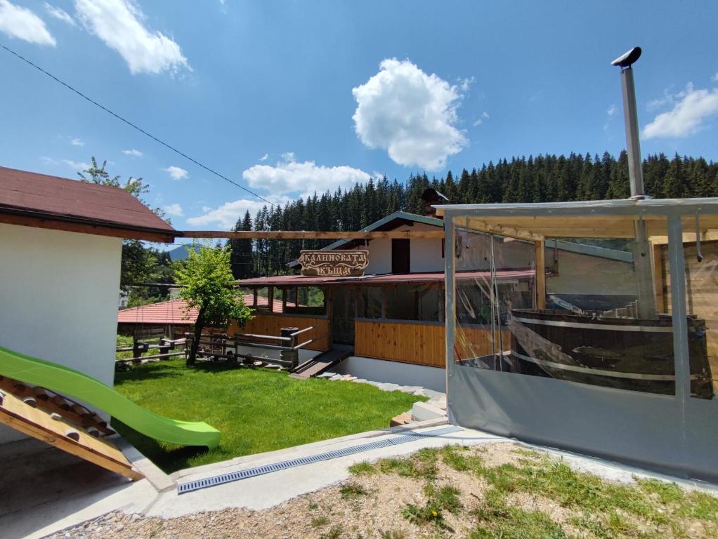 a view of a house with a yard at Калиновата къща in Stoykite