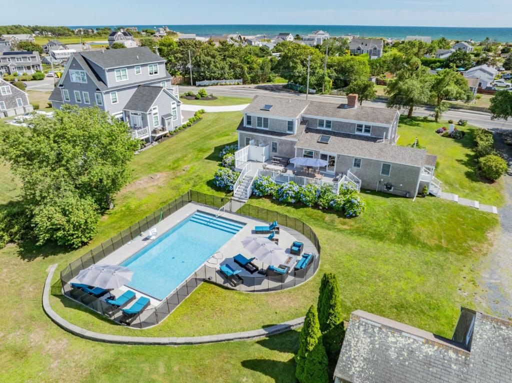 an aerial view of a house with a swimming pool at 128 Lower County Road Dennis - The Moor-a-Sea in West Dennis