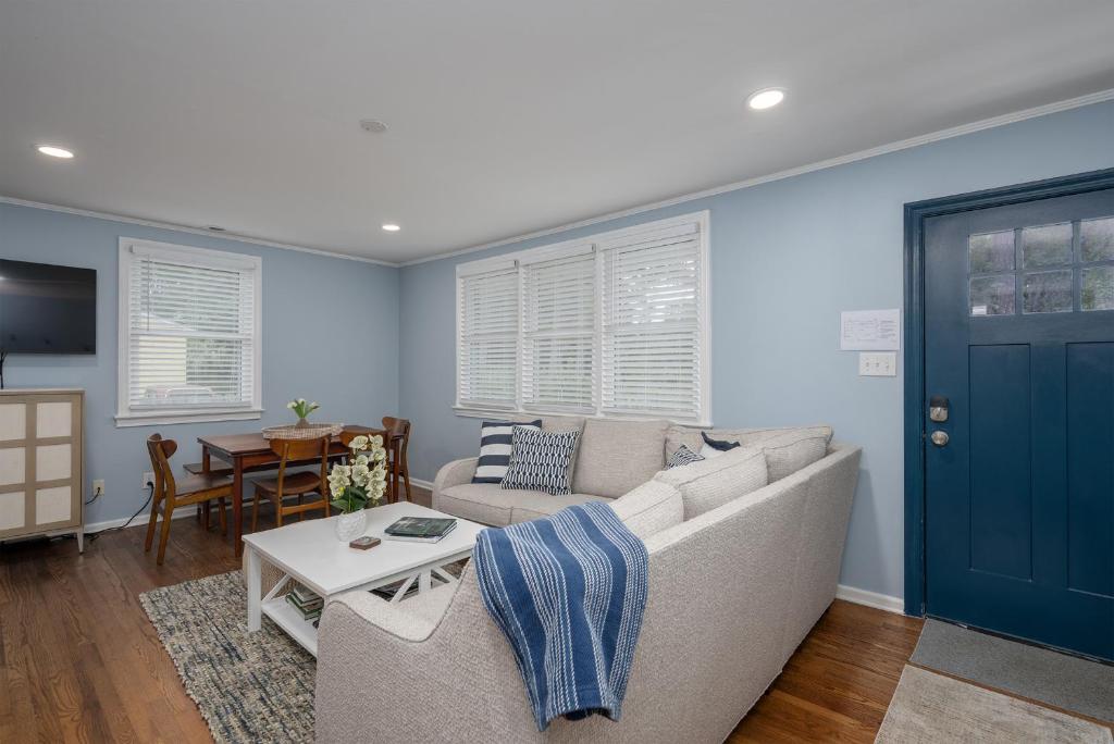 a living room with a couch and a table at Cozy 3-Bedroom Retreat in Charming Beaufort, SC in Beaufort