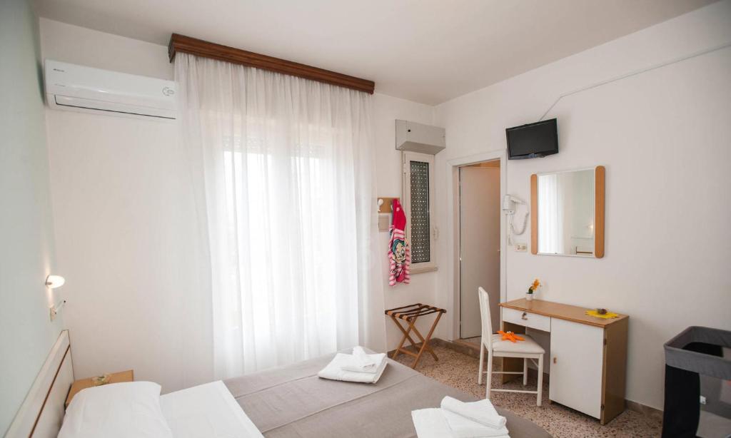 Postel nebo postele na pokoji v ubytování Hotel Massimo